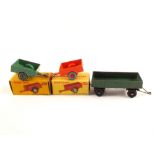 Boxed Dinky 341 Land Rover trailers with orange and green bodies plus green trailer (unboxed)
