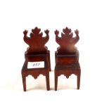 A pair of miniature mahogany hall chairs,