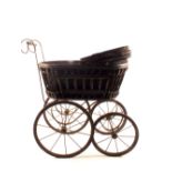 A reproduction wicker and metal dolls pram