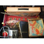 A box of assorted toys including Pelham puppet, mini microscope, roller ball game,