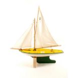 A Star Yacht of Birkenhead wooden pond yacht named 'Northern Star' in white, yellow and green,