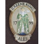 A Greene King ceramic plaque by Carter Tiles, Poole,