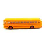 A Dinky 949 Wayne school bus in yellow with red body lines