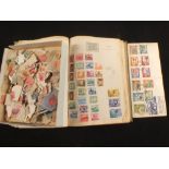 A stamp album and loose stamps including penny reds and QE2 Pitcairn Islands cover