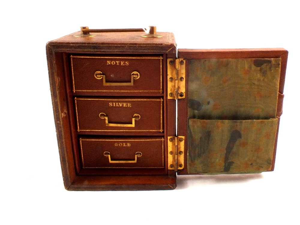 A Victorian gilt tooled leather three drawer travelling safe