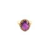 An 18ct gold amethyst and diamond cluster ring,