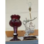 A child figure table lamp plus a Victorian ruby glass table lustre