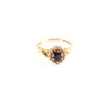 A 9ct gold sapphire and diamond cluster ring,