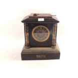 A Victorian black and variegated marble striking mantel clock