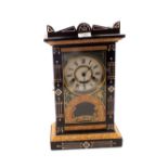 An ebonised and gilt striking mantel clock