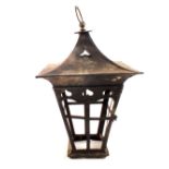 A large Arts and Crafts copper lantern with pierced heart motifs, tapering square sides,