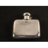 A small silver hip flask,