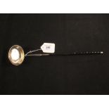 A white metal toddy ladle with Queen Anne shilling inset