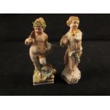 Two KPM figures of cherubs, one winged, the other on dolphin,