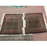 A pair of Afghan floor cushions,