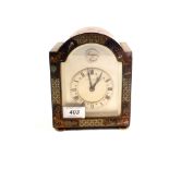 A black chinoiserie mantel clock,