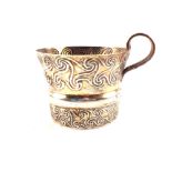 A silver cup with card stating its a reproduction of an ancient 'circle' cup,