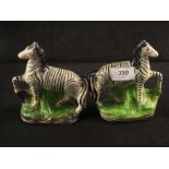 A pair of Victorian Staffordshire zebras,