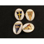 A pair of 15ct gold cufflinks with enamel yacht pennant designs (enamel is as found)