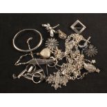 A large mixed lot of silver and white metal jewellery including flower earrings, stone set pendants,