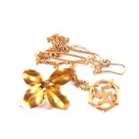 A 10ct gold flower brooch,