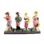 A set of four early 19th Century Staffordshire figures of Artisans (all with restoration)