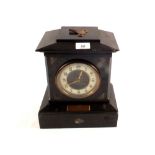 A Victorian black marble mantel clock