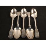 Five silver serving spoons with crested handles,