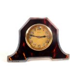 A silver and tortoiseshell table clock,