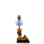 An unusual oil lamp of brass mask cornucopia form on blue porcelain base and mount plus a blue