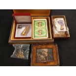 A carved card case containing cigarette cards,