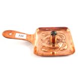 A Newlyn copper chamberstick with twin fish design, impressed mark,