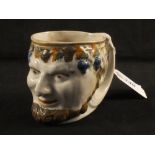 A 19th Century polychrome Bacchus mug