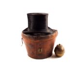 A top hat in leather case plus a Liptons 1924 Wembley brass tea caddy