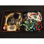 Two trays of costume jewellery including beads,