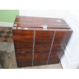 A large square mahogany metal bound storage chest