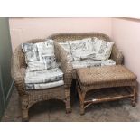 A wicker conservatory suite comprising a two seater sofa,