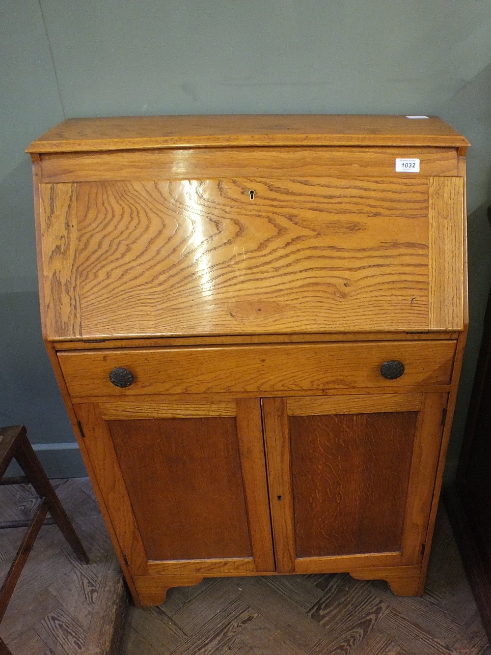 A light oak bureau with single drawer,