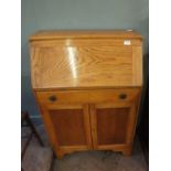 A light oak bureau with single drawer,