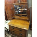An Art Nouveau dressing chest of three drawers and an oak chest of two short and two long drawers