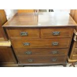 An Edwardian mahogany cross banded chest of two short and three long drawers with Art Nouveau brass