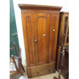 A Victorian mahogany single door wardrobe with single drawer base