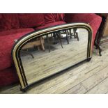 A 19th Century ebonised and gilt decorated overmantel mirror