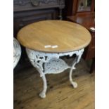 A white painted cast iron pub table with light mahogany top and under tier embossed "MASONS