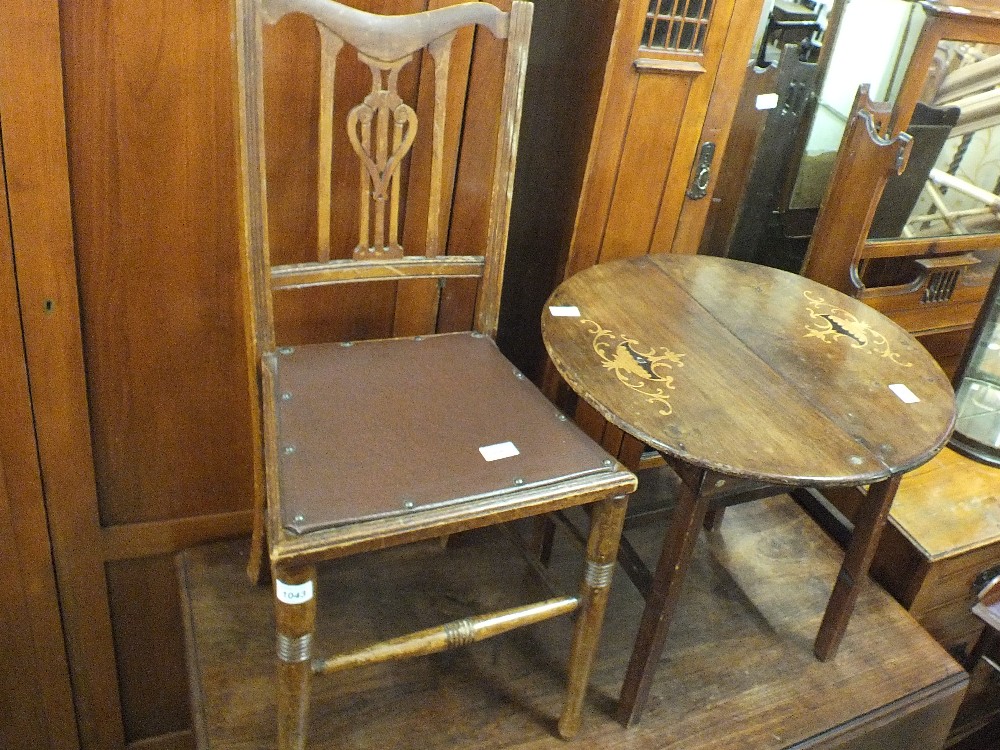 A single mahogany bedroom chair and a marquetry inlaid circular mahogany table on stained pine base