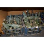 Two Crates of Victorian and Edwardian Aqua Glass Bottles Including Codds Bottles