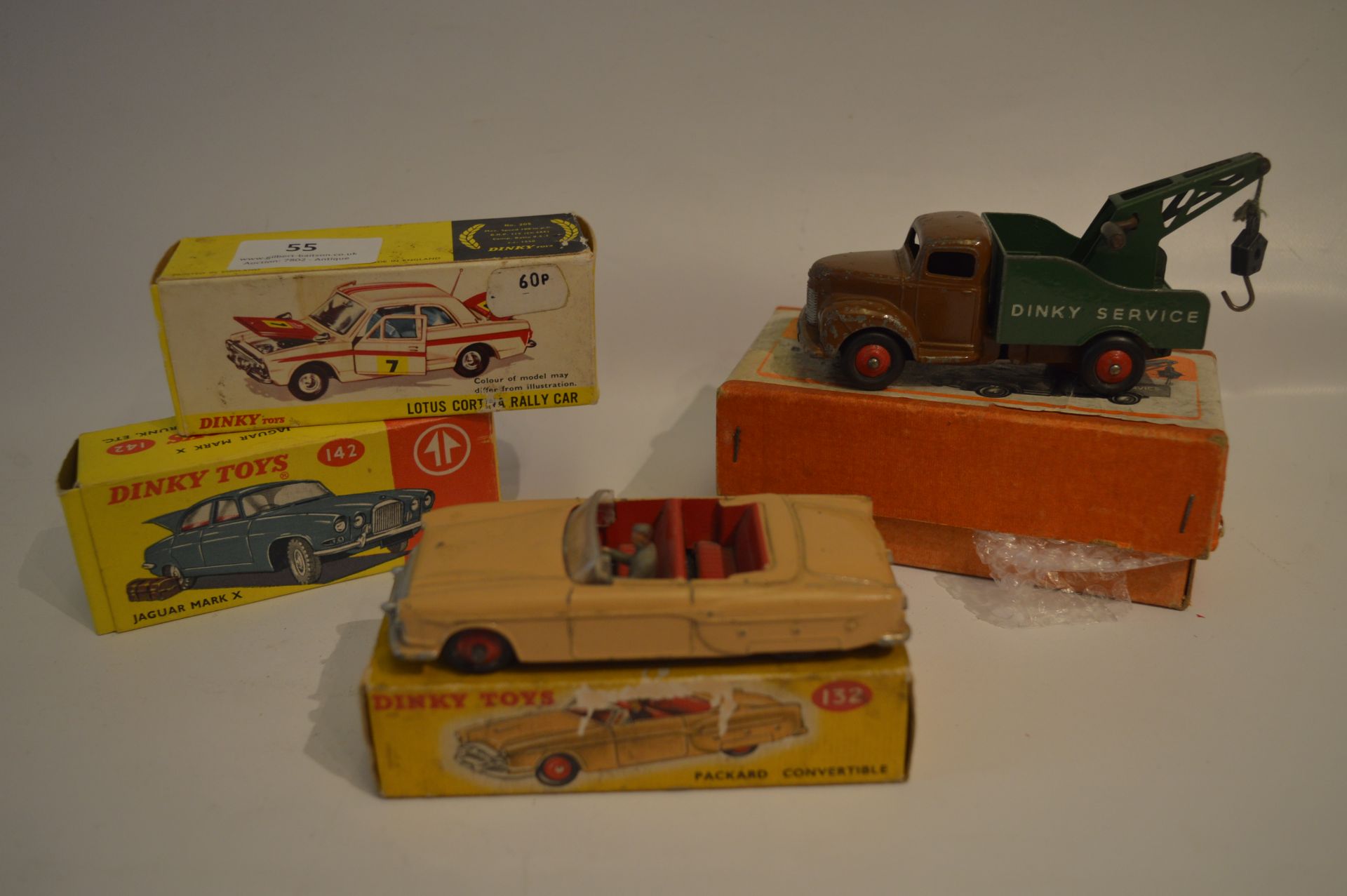 Four Boxed Dinky Vehicles: Breakdown Lorry, Jaguar, Packard Convertible and a Lotus