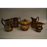 Four Copper Lustre Pottery Jugs and a Lidded Bowl