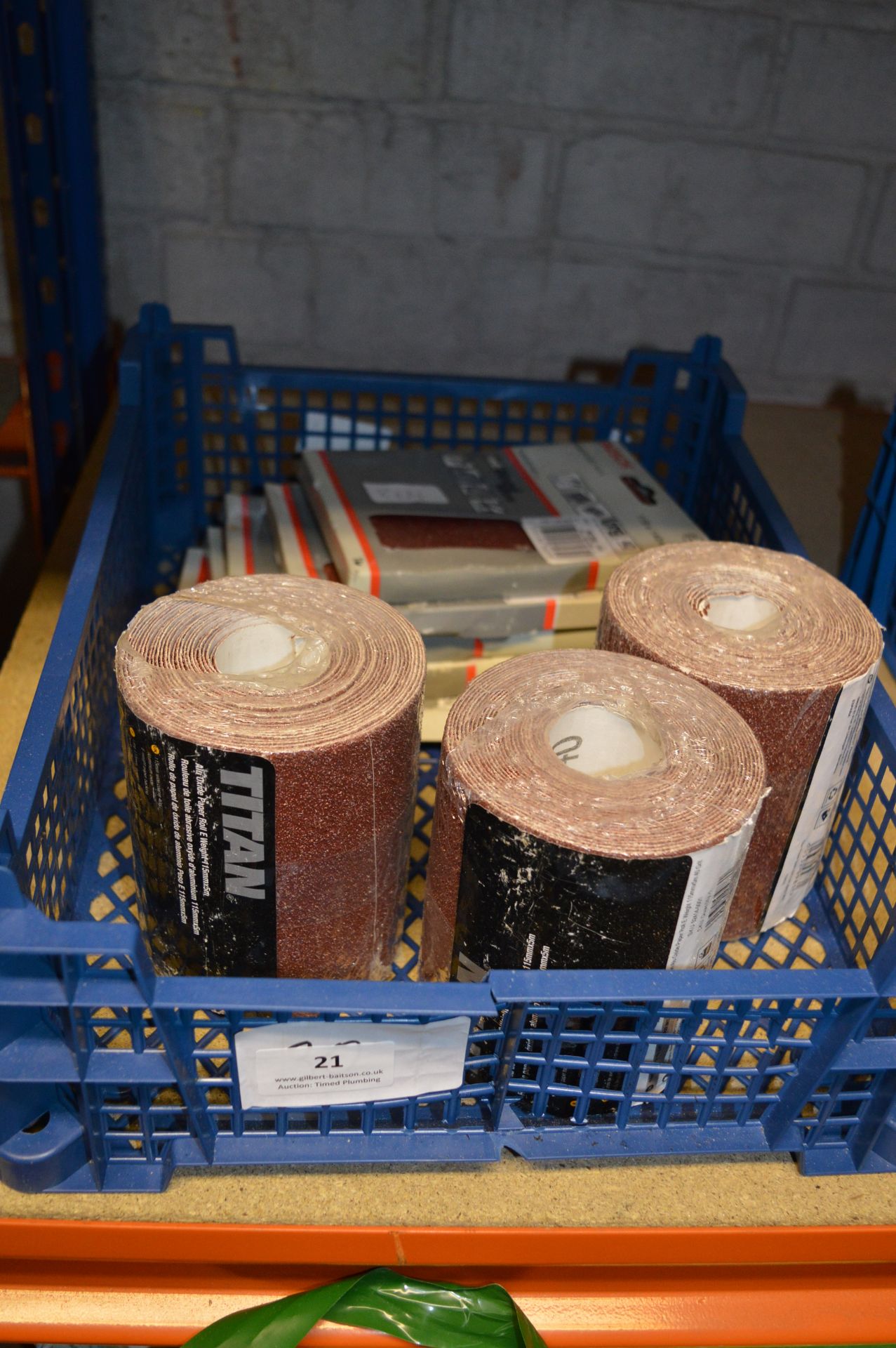 Box Containing Five Packets of Bosch Abrasive Pads and Three Rolls of Titan Abrasive Paper