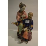 Chinese Pottery Figurine "Ear Waxing"